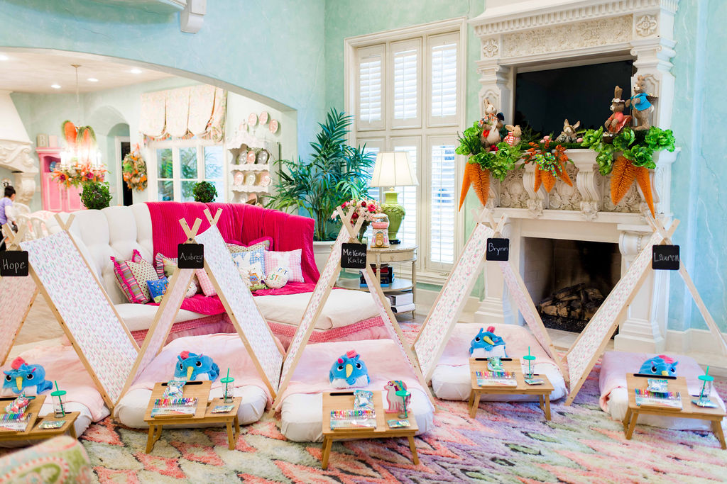 Turtle Creek Lane Home Decor Blog put together a unicorn birthday slumber party with tents with chalkboard signs, unicorn footed pajamas, and art tables